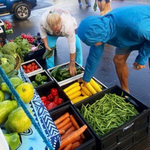 people purchasing veggies